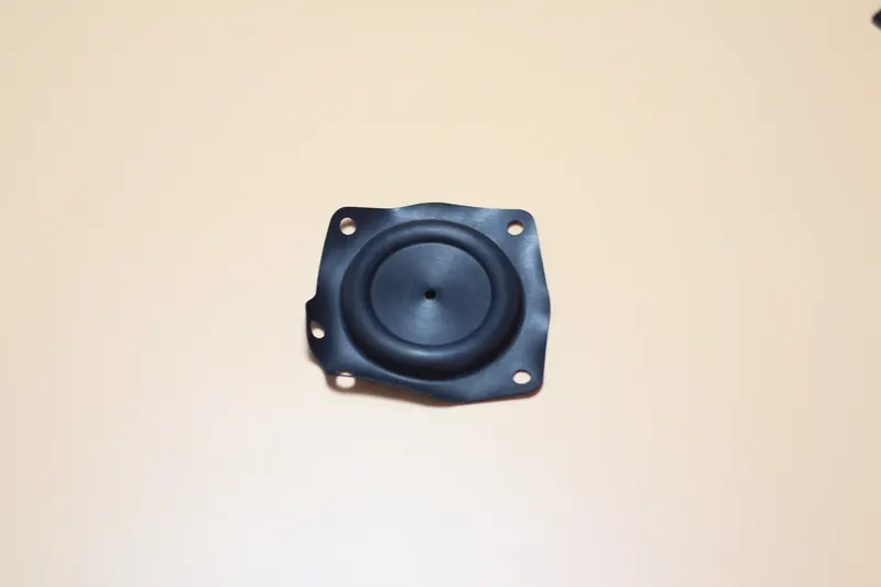 Black moulded plastic housing with a circular recess and mounting holes